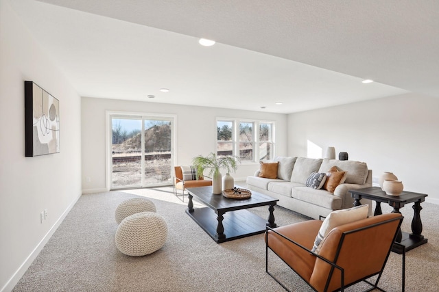 living room with light carpet and a wealth of natural light