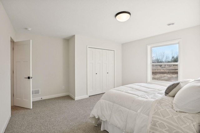 carpeted bedroom with a closet