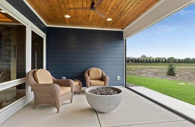 view of patio with a rural view and ceiling fan