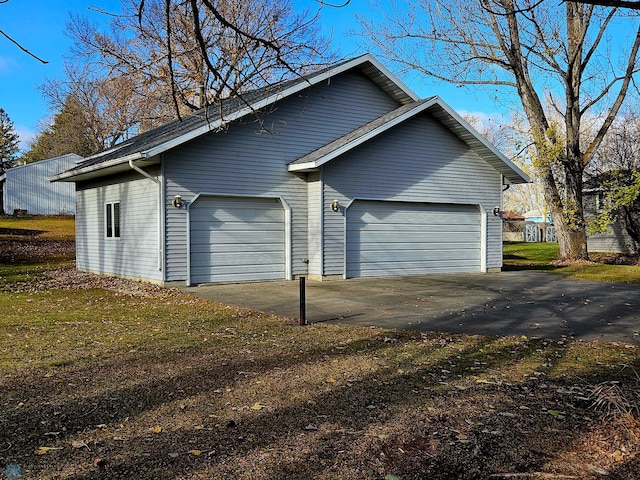 view of side of home with a garage