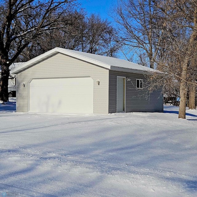 view of snow covered garage