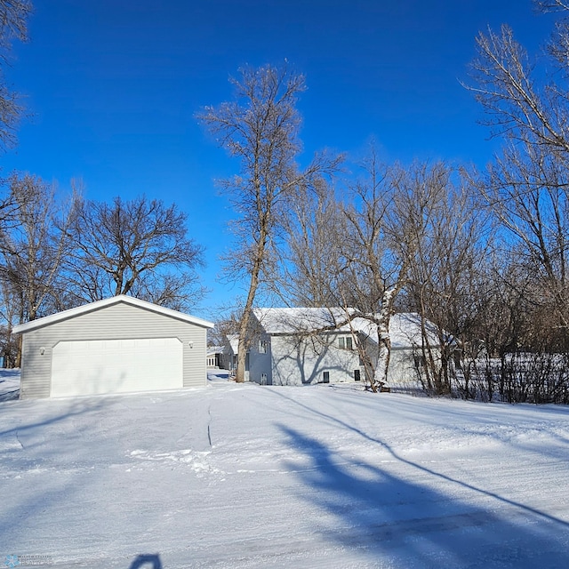 exterior space with a garage and an outdoor structure