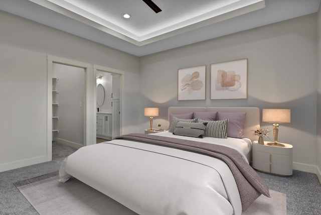 carpeted bedroom featuring ceiling fan and ensuite bath