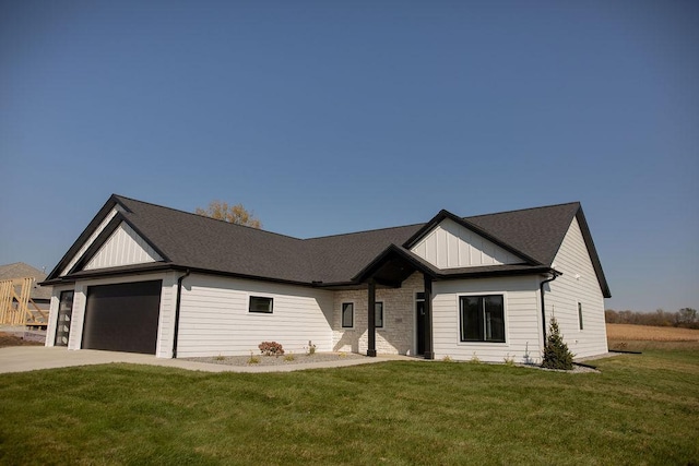 view of front facade with a front lawn and a garage