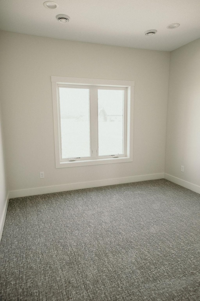 view of carpeted spare room