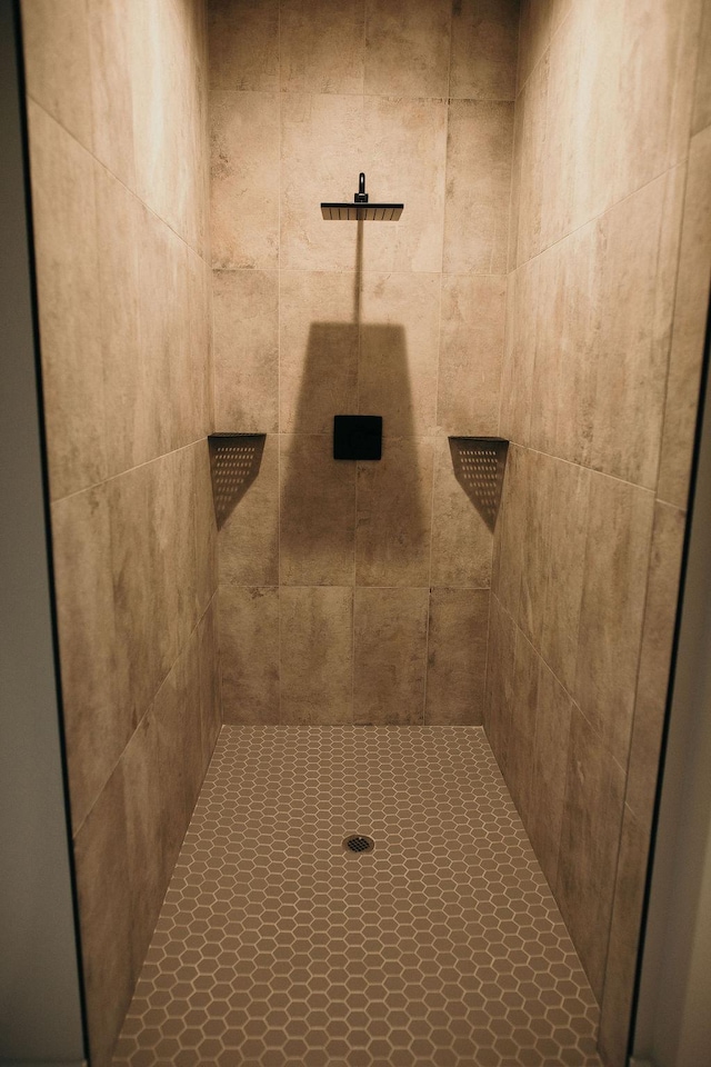 bathroom with tiled shower