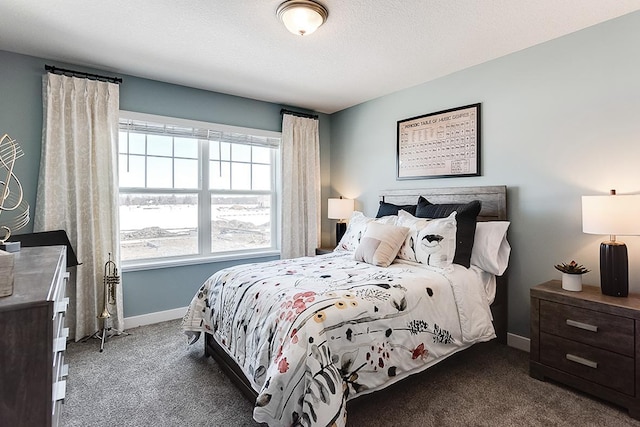 carpeted bedroom featuring a textured ceiling