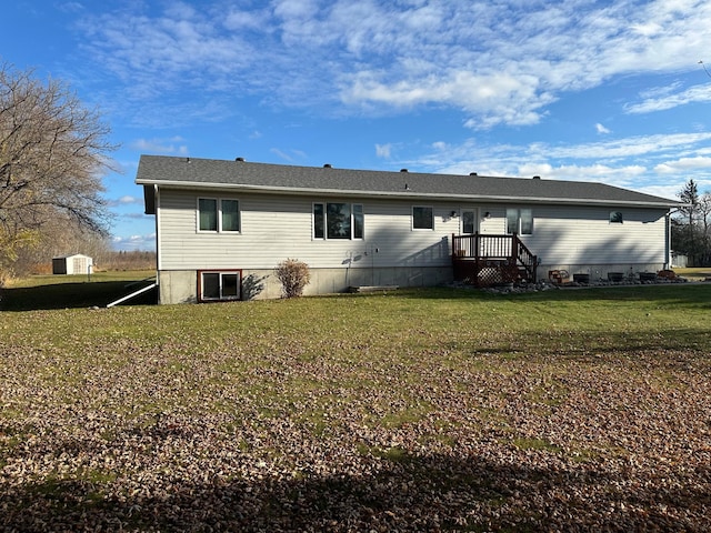 rear view of property with a lawn