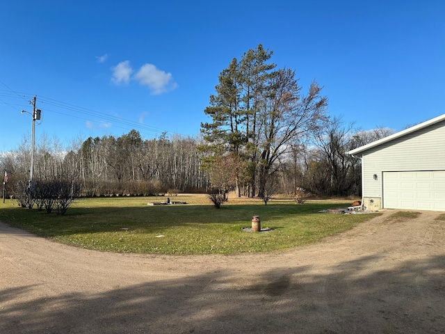 view of yard with a garage