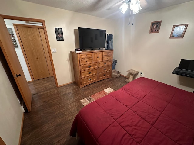 bedroom featuring dark hardwood / wood-style flooring and ceiling fan