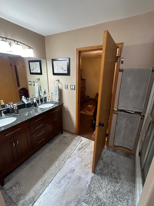 bathroom with hardwood / wood-style floors and vanity