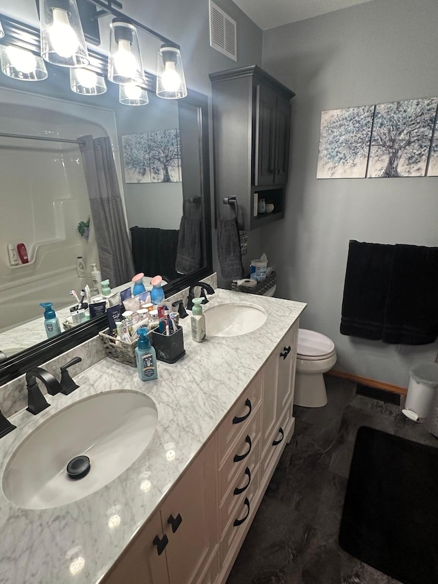 bathroom with vanity and toilet