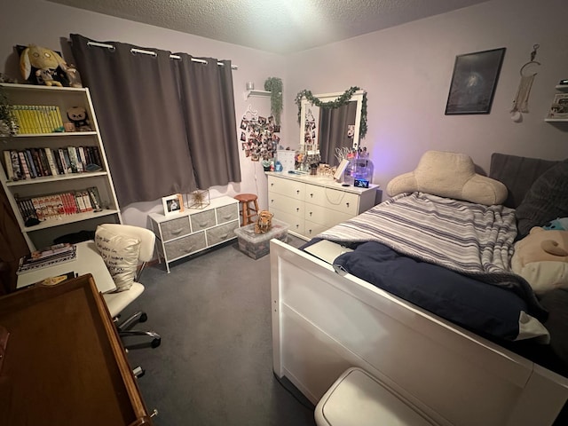 carpeted bedroom featuring a textured ceiling