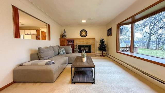 carpeted living room featuring a fireplace and a baseboard heating unit