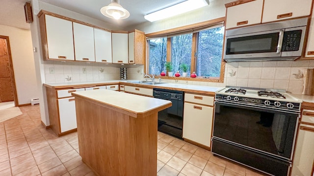 kitchen with white cabinetry, black dishwasher, range, and a center island