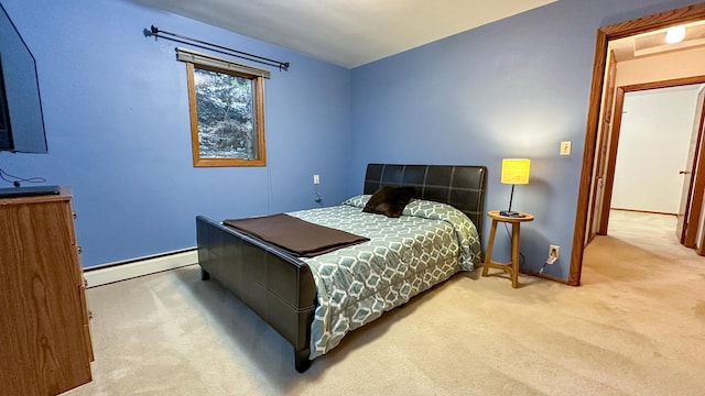 bedroom featuring a baseboard heating unit and carpet floors