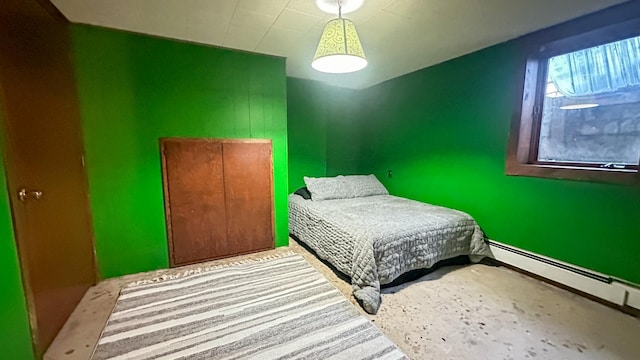 bedroom with a baseboard heating unit