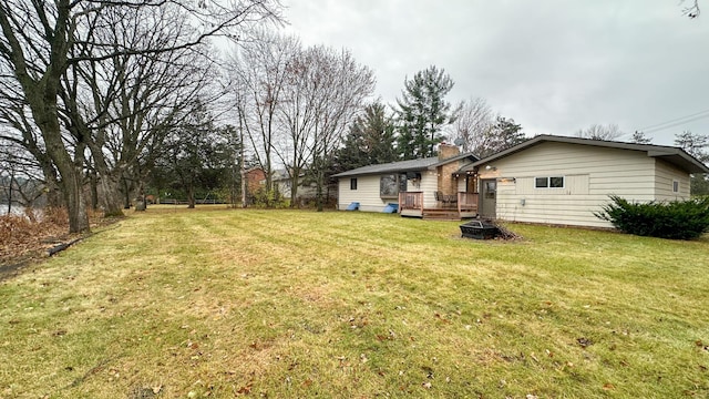 view of yard with a wooden deck