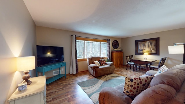 living room with dark hardwood / wood-style flooring