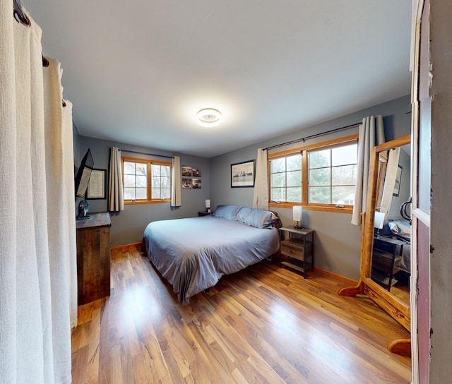 bedroom with light hardwood / wood-style floors