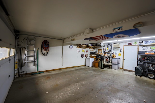 garage featuring a workshop area and washer / dryer