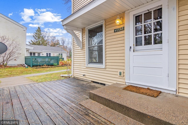 property entrance with a deck