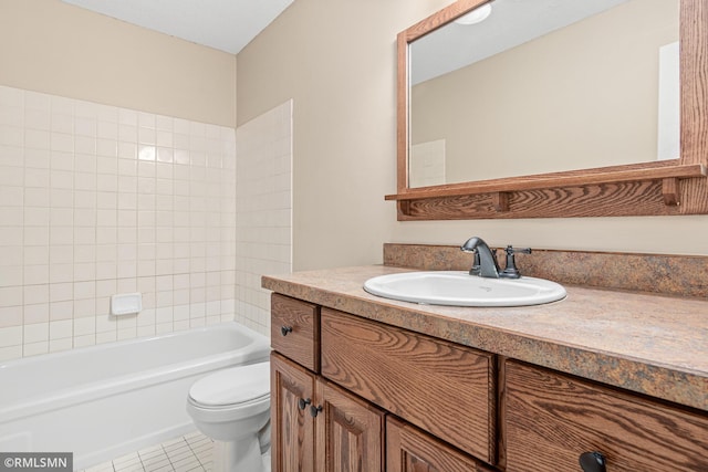 full bathroom with tile patterned floors, vanity, toilet, and tiled shower / bath combo