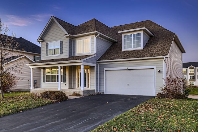 view of front of home featuring a garage and covered porch