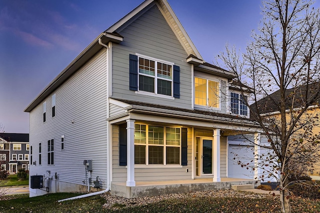 view of front of property with central air condition unit and covered porch