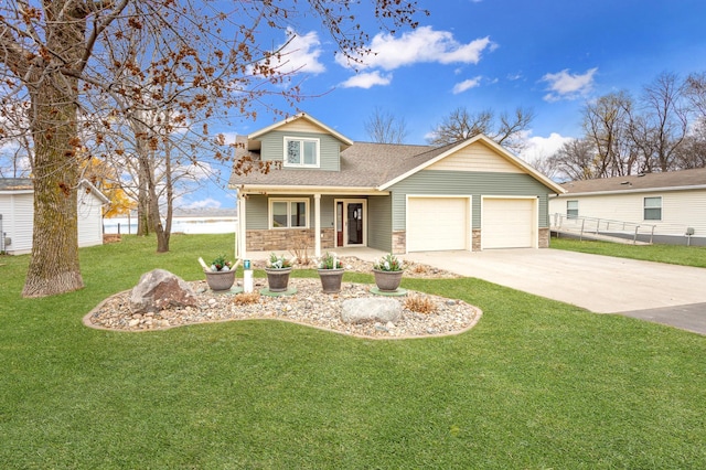 view of front of home with a front yard, a porch, and a garage