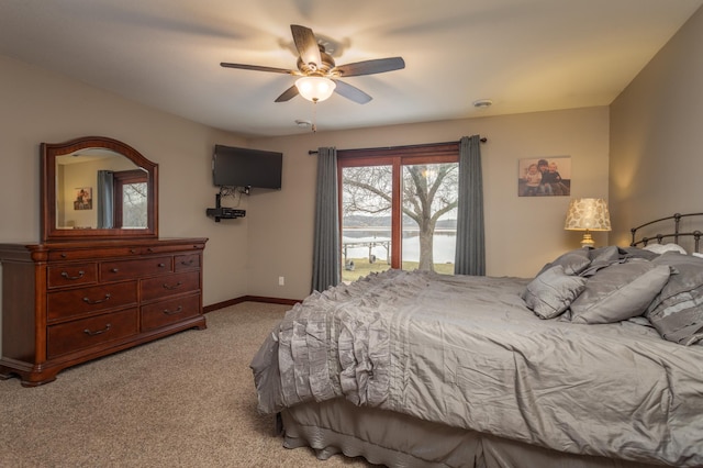 bedroom featuring ceiling fan and light carpet