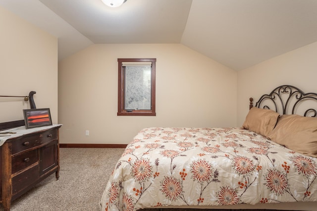 bedroom featuring light carpet and lofted ceiling