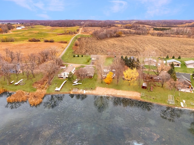 drone / aerial view featuring a rural view and a water view