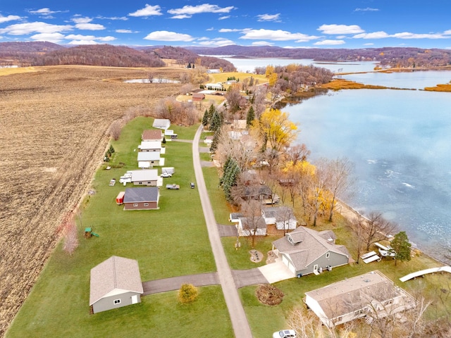 bird's eye view with a water and mountain view