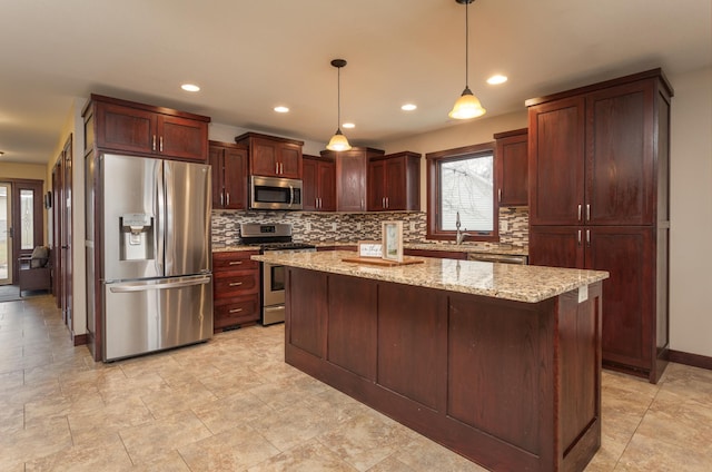 24539 Twilight Ln, Pelican Rapids, MN 56572 - kitchen featuring appliances with stainless steel finishes, backsplash, a sink, a center island, and decorative light fixtures