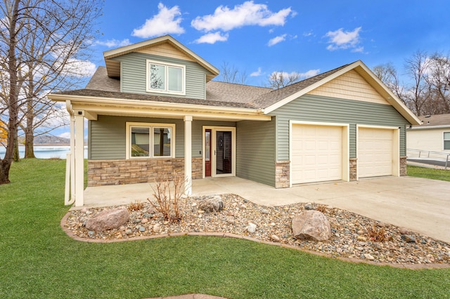 24539 Twilight Ln, Pelican Rapids, MN 56572 - view of front of home with roof with shingles, a front yard, an attached garage, and stone siding