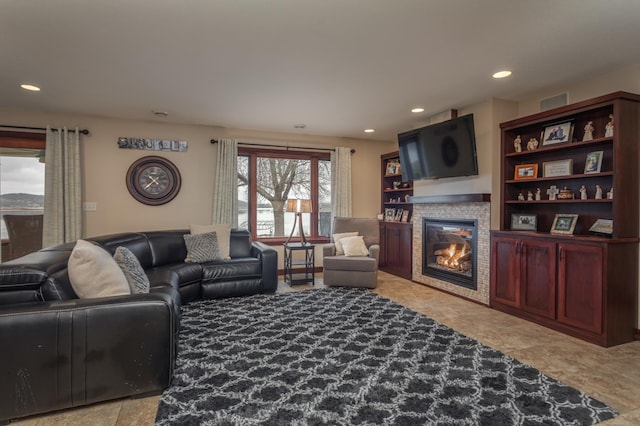 24539 Twilight Ln, Pelican Rapids, MN 56572 - living area featuring a glass covered fireplace and recessed lighting