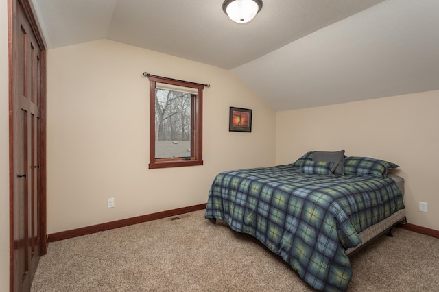 24539 Twilight Ln, Pelican Rapids, MN 56572 - carpeted bedroom featuring lofted ceiling and baseboards