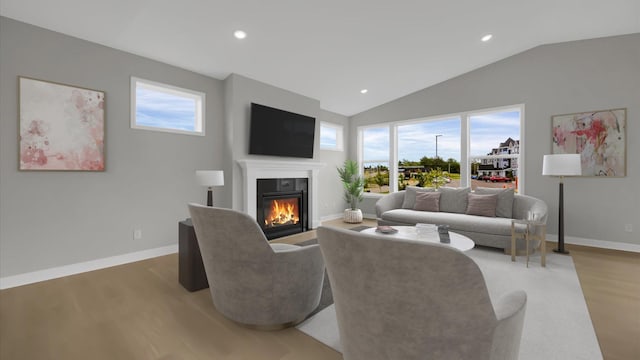 living room with wood-type flooring and lofted ceiling