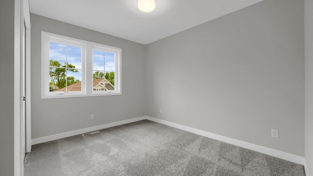 empty room featuring carpet flooring