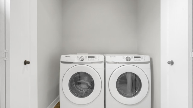 clothes washing area featuring washer and dryer