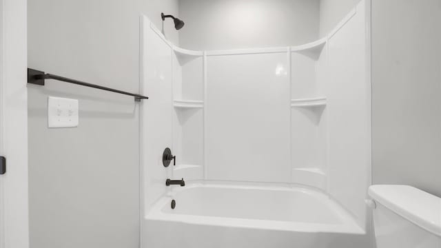 bathroom featuring toilet and shower / bath combination