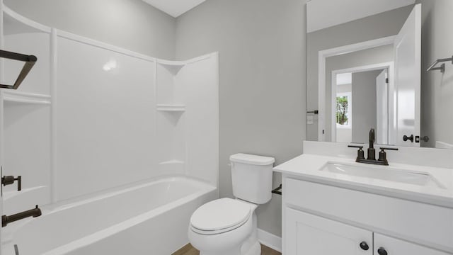 full bathroom featuring shower / washtub combination, vanity, and toilet