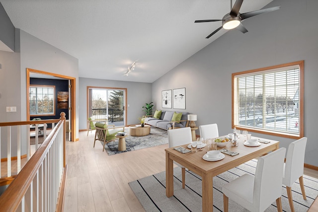 dining room featuring vaulted ceiling, ceiling fan, and light hardwood / wood-style floors