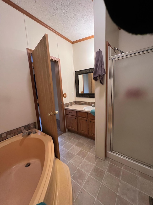 bathroom with vanity, a textured ceiling, tile patterned floors, and independent shower and bath