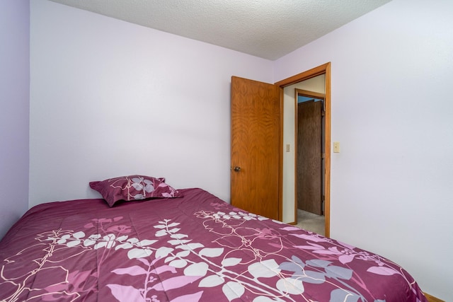 unfurnished bedroom with a textured ceiling