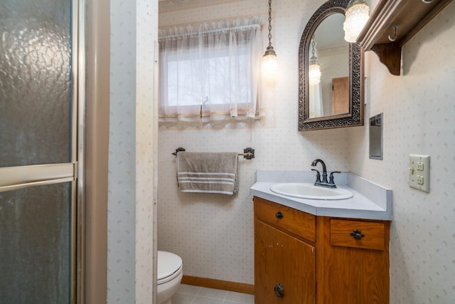 bathroom with vanity, tile patterned floors, and toilet