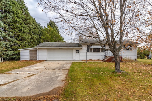 ranch-style home with a garage and a front yard