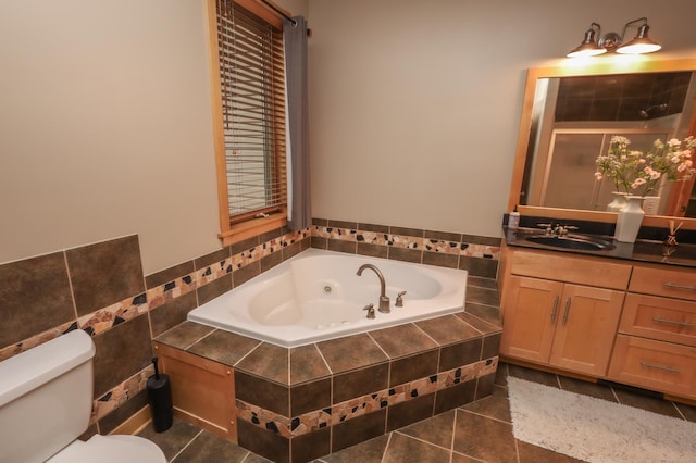 full bathroom featuring toilet, vanity, tile patterned floors, and independent shower and bath