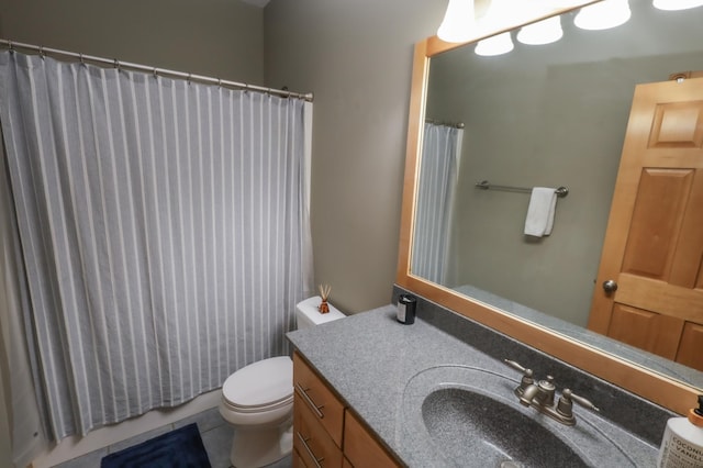 bathroom with tile patterned floors, walk in shower, vanity, and toilet